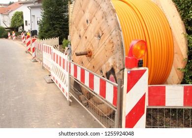 Orange Fiber Optic Cable On The Street