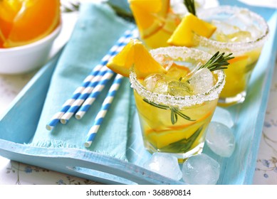 Orange Fizz In A Glass On Turquoise Background.