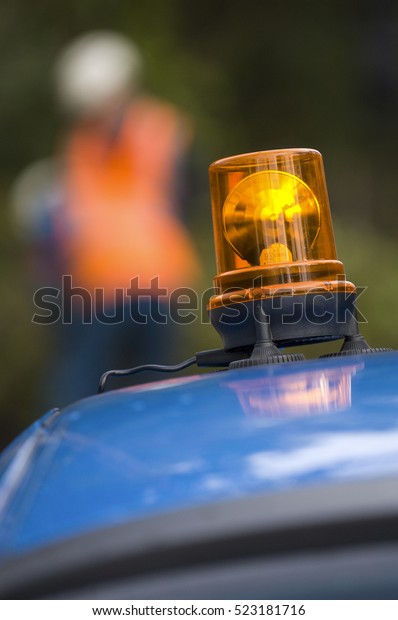 Orange flashing and revolving light on\
top of a support and services vehicle,\
France