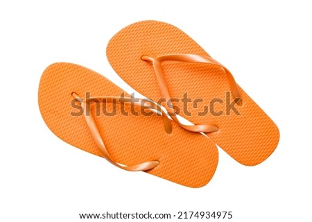 Orange flip flops isolated on white background. Top view.