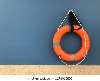 Orange float ring in the wall blue