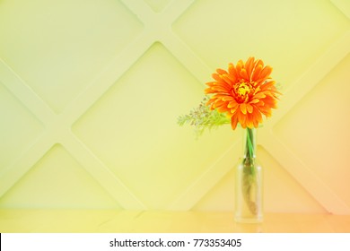 Orange Flowers In A Vase On The Table. Green Background,Soft And Blur Flower