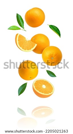 Orange fruit with cut half sliced and green leaves levitate isolated on white background.