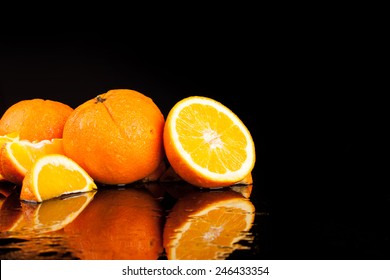 Orange Fruit Isolated On A Black Background