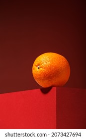 Orange Fruit On Red Background, Minimal Food Concept