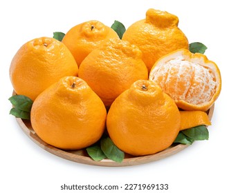 Orange fruit on wooden plate isolated on white background, Dekopon orange or sumo mandarin tangerine on White Background With work path.