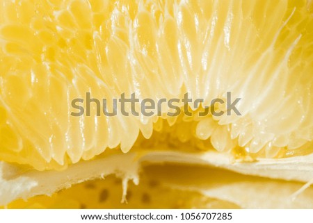 Orange fruit. Orang slice isolate on white. A slice of yellow orange pamela macro. Cages of fresh citrus fruit