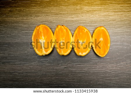 Orange fruit. Orange slice isolate on black wood.