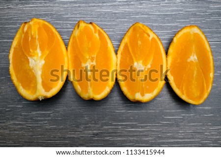 Orange fruit. Orange slice isolate on black wood.