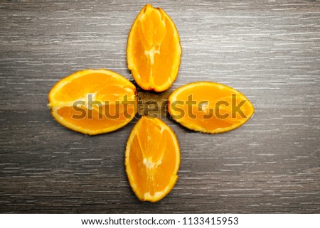 Orange fruit. Orange slice isolate on black wood.
