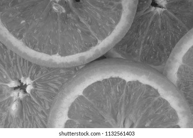 Orange fruit slice. Selective focus and crop fragment. Black and White