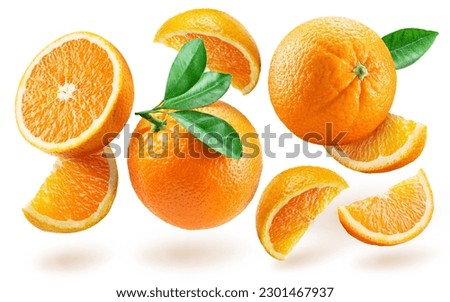 Orange fruits and slices of orange fruit levitating in air on white background. 