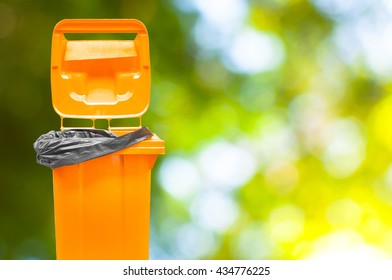 Orange Garbage bins on  nature green background - Shutterstock ID 434776225