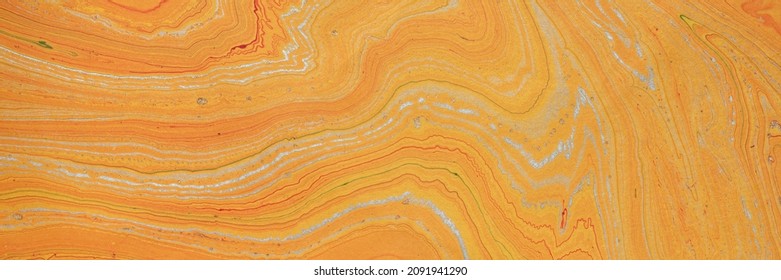 orangefarbenes und goldenes Marmorpapier aus recycelter Jutefaser, abstrakter Hintergrund