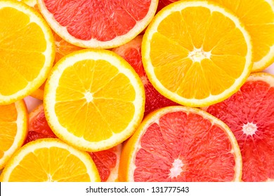 Orange And Grapefruit Rings As Background