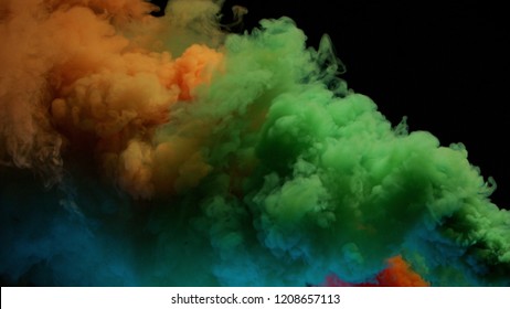 Orange And Green Bomb Smoke On Black Background