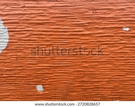 orange grumbled surface with white spot 