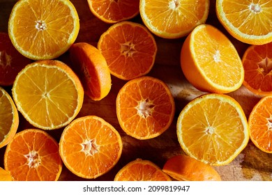 Orange Halves on Chopping Board