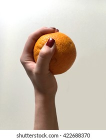 orange in hand