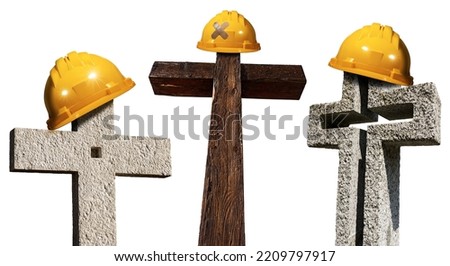 Orange hard hat or safety helmet on a stone or wooden cross, isolated on white background. Workplace death and accidents concept.