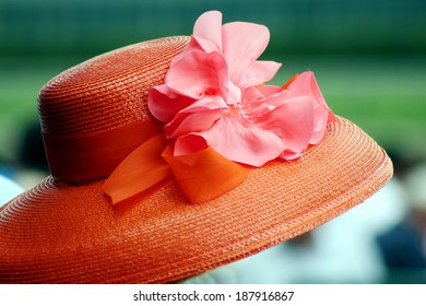 Orange Hat With Silk Flower Worn On Race Day