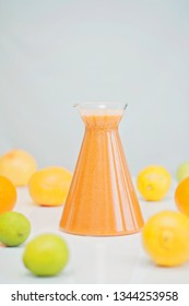 An Orange Healthy Drink For Detoxing. Juicing Non-alcoholic Cocktail To Boost Immune System. Energizing And Vitamin Rich Juice Drink For Happy Mood. Bright And Colorful Beverage As A Flu Fighter