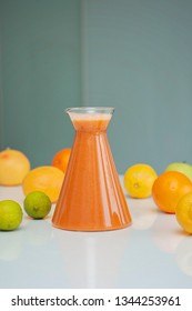 An Orange Healthy Drink For Detoxing. Juicing Non-alcoholic Cocktail To Boost Immune System. Energizing And Vitamin Rich Juice Drink For Happy Mood. Bright And Colorful Beverage As A Flu Fighter