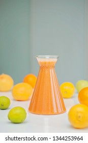 An Orange Healthy Drink For Detoxing. Juicing Non-alcoholic Cocktail To Boost Immune System. Energizing And Vitamin Rich Juice Drink For Happy Mood. Bright And Colorful Beverage As A Flu Fighter