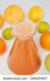 An Orange Healthy Drink For Detoxing. Juicing Non-alcoholic Cocktail To Boost Immune System. Energizing And Vitamin Rich Juice Drink For Happy Mood. Bright And Colorful Beverage As A Flu Fighter