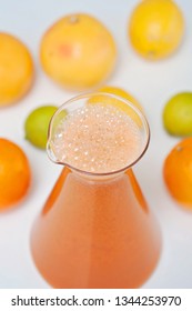 An Orange Healthy Drink For Detoxing. Juicing Non-alcoholic Cocktail To Boost Immune System. Energizing And Vitamin Rich Juice Drink For Happy Mood. Bright And Colorful Beverage As A Flu Fighter