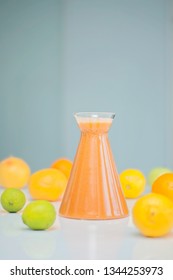 An Orange Healthy Drink For Detoxing. Juicing Non-alcoholic Cocktail To Boost Immune System. Energizing And Vitamin Rich Juice Drink For Happy Mood. Bright And Colorful Beverage As A Flu Fighter