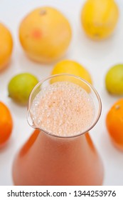 An Orange Healthy Drink For Detoxing. Juicing Non-alcoholic Cocktail To Boost Immune System. Energizing And Vitamin Rich Juice Drink For Happy Mood. Bright And Colorful Beverage As A Flu Fighter