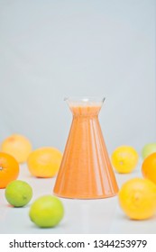 An Orange Healthy Drink For Detoxing. Juicing Non-alcoholic Cocktail To Boost Immune System. Energizing And Vitamin Rich Juice Drink For Happy Mood. Bright And Colorful Beverage As A Flu Fighter