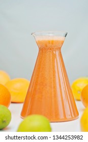 An Orange Healthy Drink For Detoxing. Juicing Non-alcoholic Cocktail To Boost Immune System. Energizing And Vitamin Rich Juice Drink For Happy Mood. Bright And Colorful Beverage As A Flu Fighter