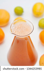 An Orange Healthy Drink For Detoxing. Juicing Non-alcoholic Cocktail To Boost Immune System. Energizing And Vitamin Rich Juice Drink For Happy Mood. Bright And Colorful Beverage As A Flu Fighter