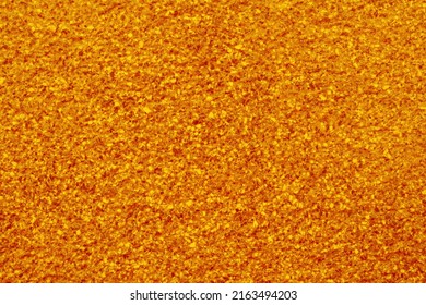 Orange, highly granular structure with resemblances to gold