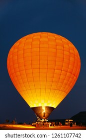 Orange Hot Air Balloon With Fire In Night Before Flying