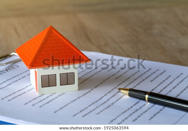 Orange\
house on sale contract Ideas for real estate, moving your home or\
renting a home, buying a home, have text\
space.