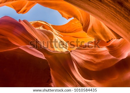 Orange hue rocks reach skyward in lower Antelope Canyon, Page, Arizona