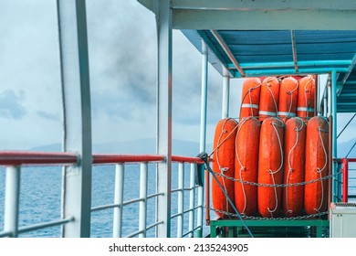 Orange Inflatable Lifeboats On Ferry Deck For Emergencies And Maritime Accidents. Rescue Boat, Raft On The Roof Of A Ferry.  Life Boats On Big Ship On Ocean Sea Cruise Ship.Transportation And Safety.