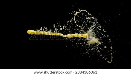 Orange Juice Exploding and Splashing on Black Background