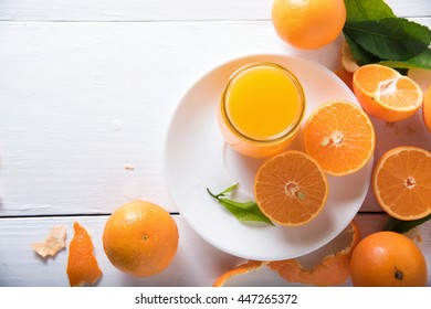 Orange Juice On White Wooden Table. Top View