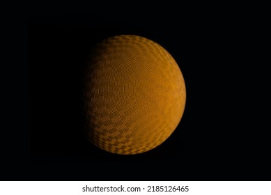 Orange Kickball Dodgeball Sports Ball Inflatable Textured Grip Generic Athletic Rubber Gym Ball With Weave Texture. Wall Ball Used For Common Recreational Sports Games And Gym Class. Dark Lighting. 