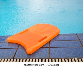Orange Kickboard Beside The Swimming Pool, Flutter Board.