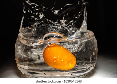 Orange Kumquat Fruit Falls At High Speed Into A Glass Container To Make Sweet Or Jam Cordoba Argentina