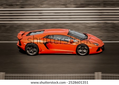 Orange lamborghini in a blur