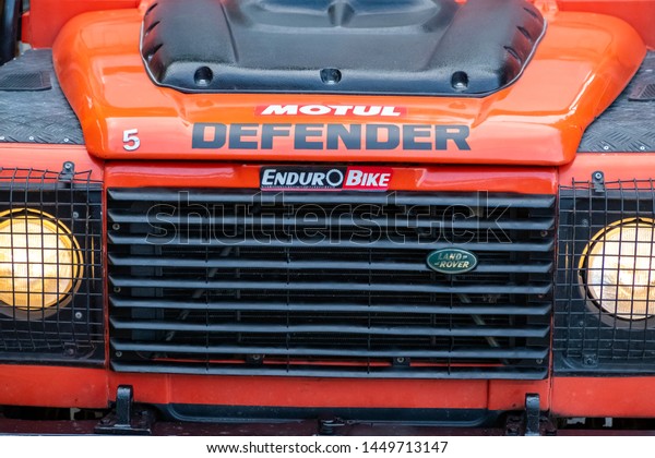 Orange Land Rover Defender.\
Front side of offroad vehicle. 4x4 tour. 12 June 2019, Kemer,\
Turkey.