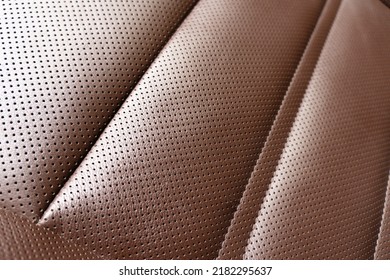 Orange Leather Interior. Part Of Brown Leather Car Seat Details With Stitching. Interior Of Prestige Car. Comfortable Brown Perforated Leather Seats Texture Background