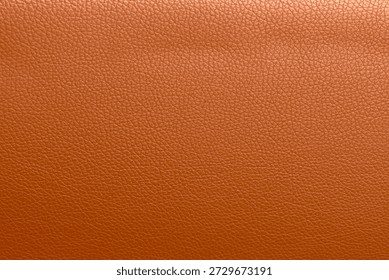 Orange leather texture background.Use for jacket sofa book cover tag shoes.Rich brown leather jacket close up, macro brown leather jacket texture, soft rugged grain pattern surface fashion design bg