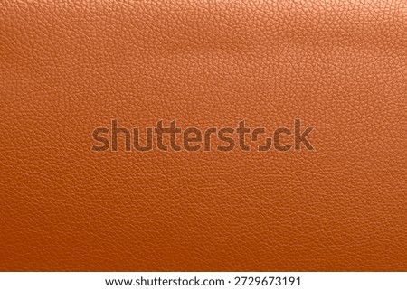 Orange leather texture background.Use for jacket sofa book cover tag shoes.Rich brown leather jacket close up, macro brown leather jacket texture, soft rugged grain pattern surface fashion design bg